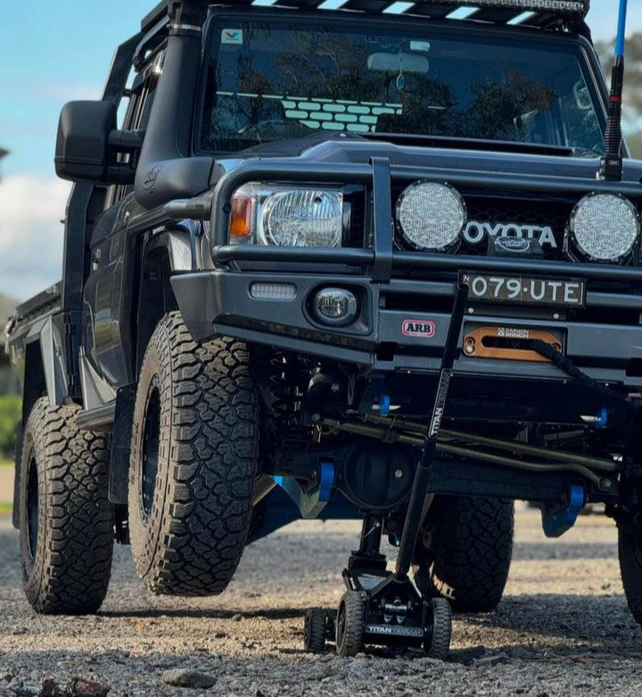 Titan Terrain rugged off-road floor jack lifting up modified black ute