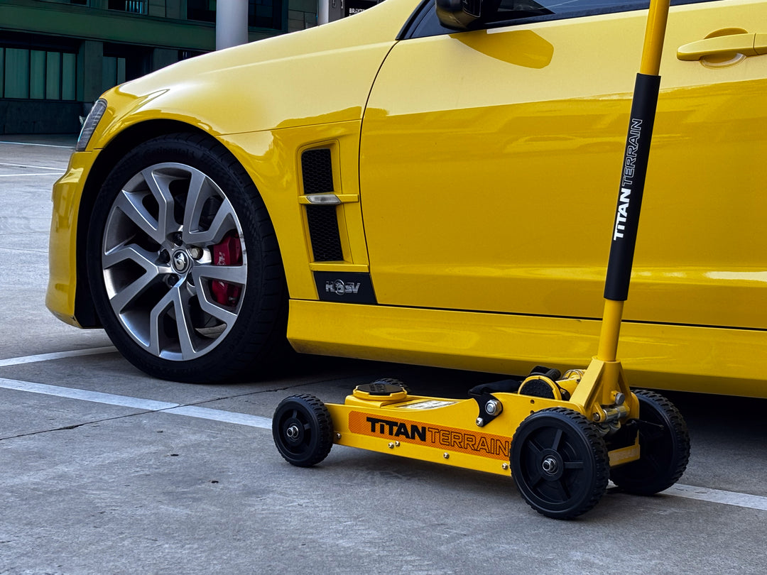 Titan Terrain 3 tonne rugged floor jack in hi-vis yellow