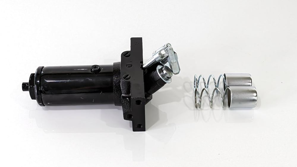 A black replacement pump for the Titan Terrain rugged Jack, featuring metal springs and hardware for installation